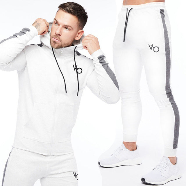 White Sleek & comfy gym jogger sports suit. Breathable fabric, stylish design, perfect for any workout.