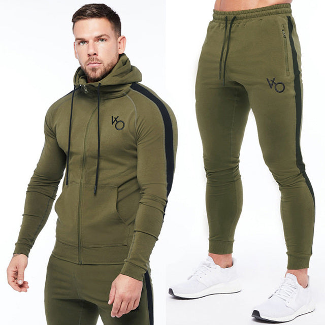 Army green Sleek & comfy gym jogger sports suit. Breathable fabric, stylish design, perfect for any workout.