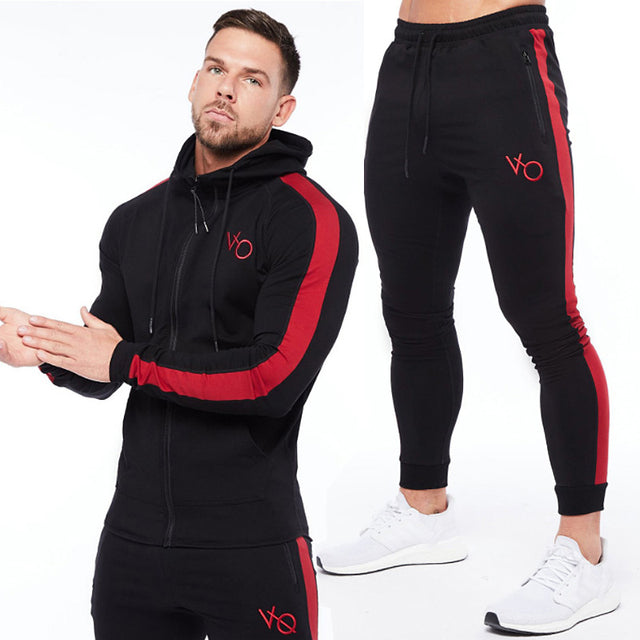 Black and red Sleek & comfy gym jogger sports suit. Breathable fabric, stylish design, perfect for any workout.