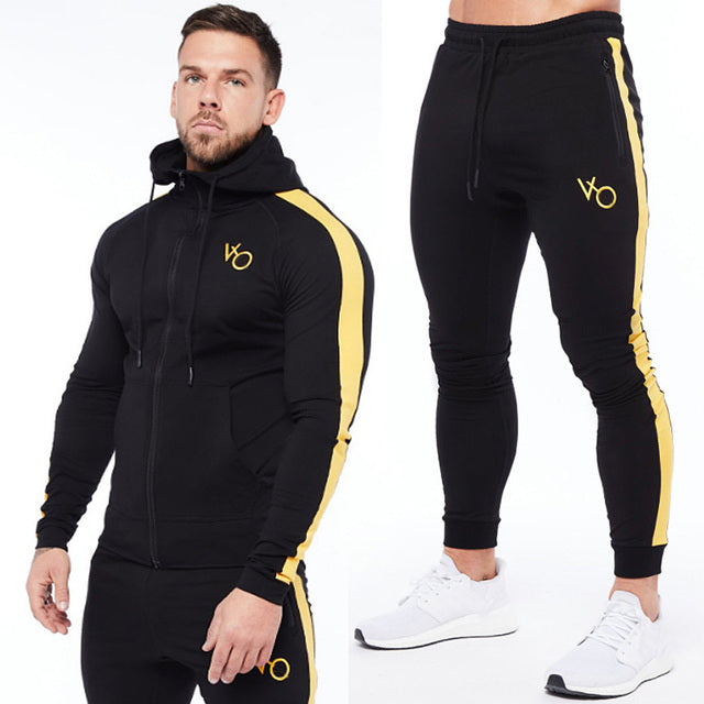 Black Sleek & comfy gym jogger sports suit. Breathable fabric, stylish design, perfect for any workout.