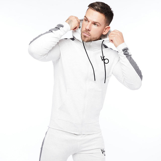 White Sleek & comfy gym jogger sports suit. Breathable fabric, stylish design, perfect for any workout.