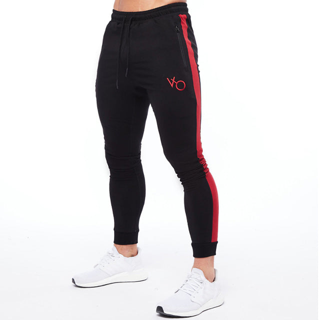 Black Sleek & comfy gym jogger sports suit. Breathable fabric, stylish design, perfect for any workout.